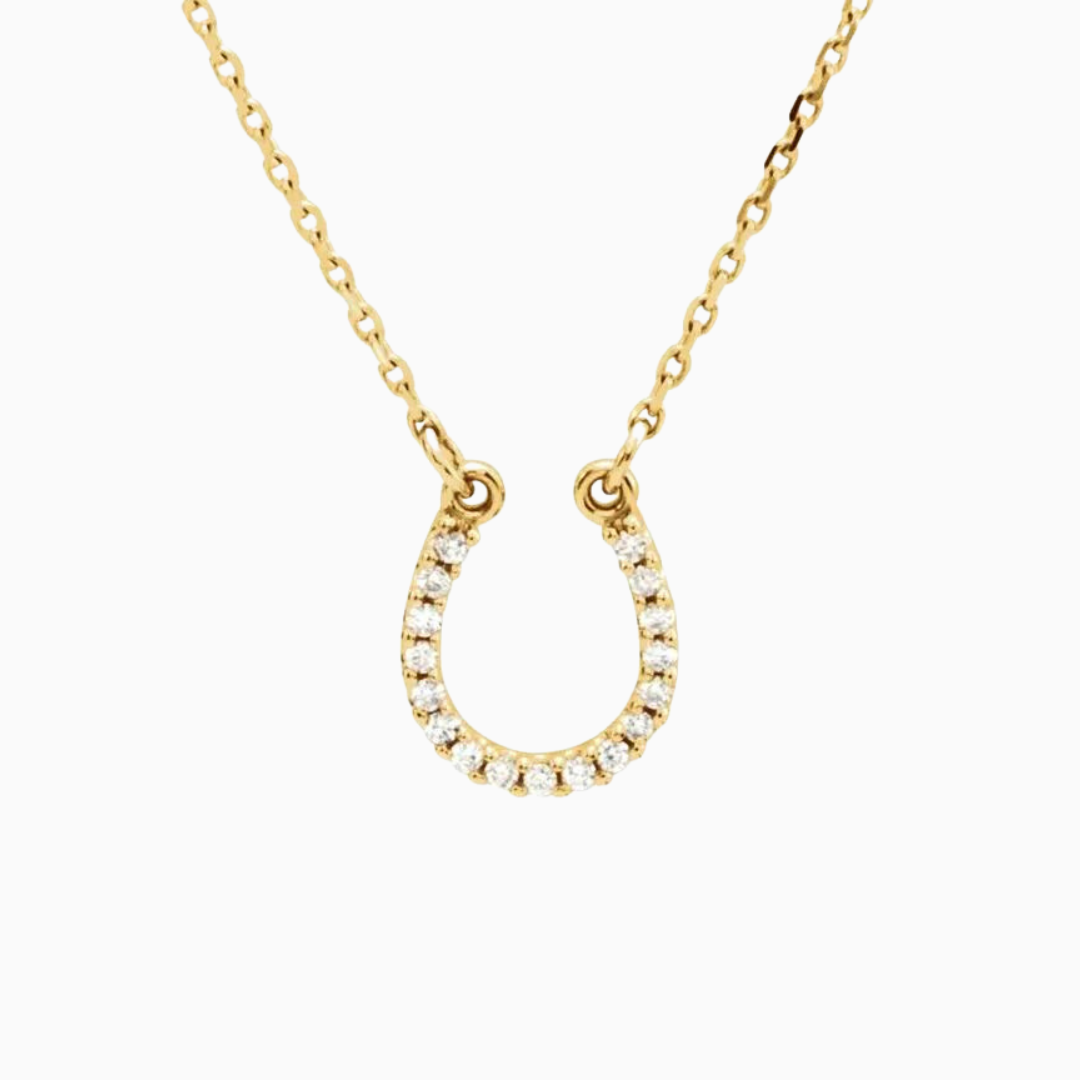  This Cowgirl Up Necklace boasts a 16" 14k gold chain with a 0.07 ctw natural diamond horseshoe.