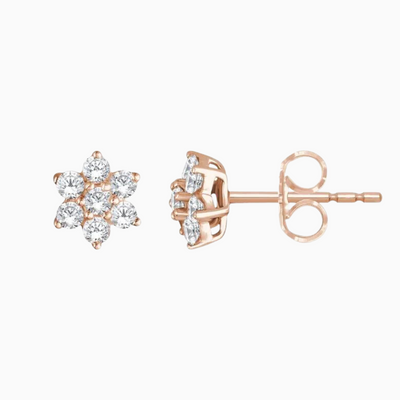 Crafted with 14k gold and natural diamonds, these flower-shaped studs offer 3/8 CTW of sparkling diamonds to enjoy. Sold as a pair.