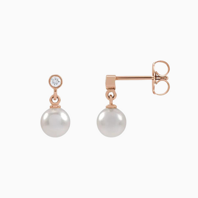 14K Rose Gold .06 CTW Natural Diamond and Cultured White Akoya Pearl Earrings. Sold as a pair.