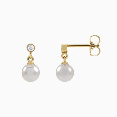 14K Yellow Gold .06 CTW Natural Diamond and Cultured White Akoya Pearl Earrings. Sold as a pair.