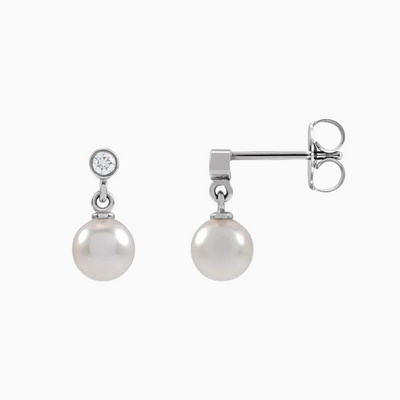 14K White Gold .06 CTW Natural Diamond and Cultured White Akoya Pearl Earrings. Sold as a pair.