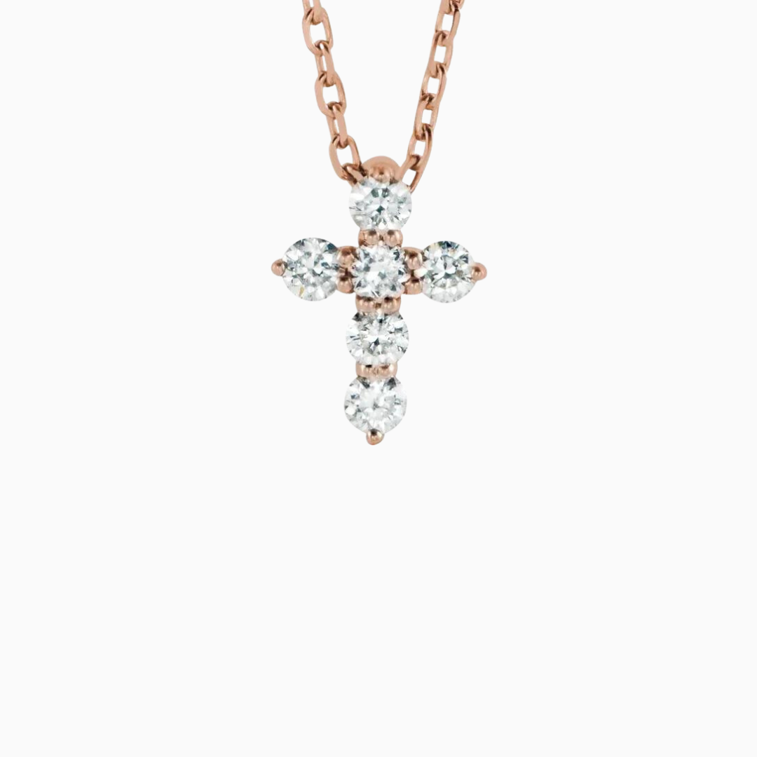 This adjustable 16-18" 14k Gold & Natural Diamonds Cross Necklace features 1/6 ct of Natural Diamonds in an 8.7 x 6.3mm size. It is available in yellow, white, and rose gold.