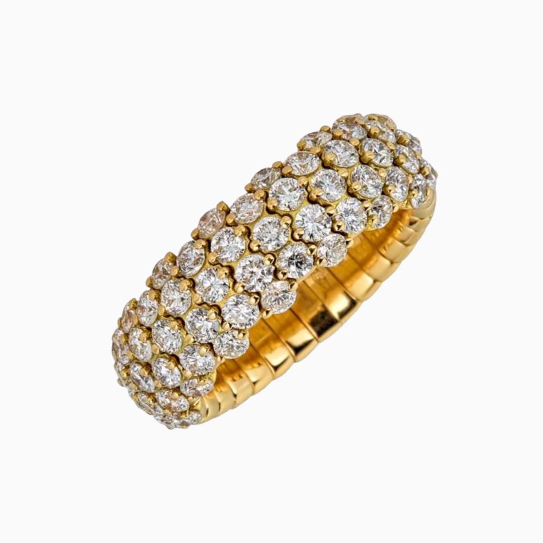 Boasting 18k yellow gold and round diamonds half-set on a strong patented stretch cord, this ring is sure to impress.