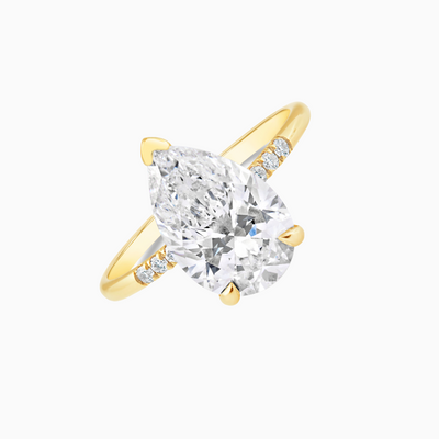  This GIA Certified 3.01 Carat D VS1 Emerald Cut Lab Grown Diamond is set in an 18k Yellow Gold band with six sparkling side diamonds.