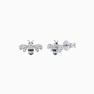 Crafted from 14k Gold, our Black and Natural Diamond Bumble Bee Stud Earrings come in a pair and are available in White, Yellow and Rose Gold.  White Diamond Weight: 0.12 ct. Black Diamond Weight: 0.05 ct.