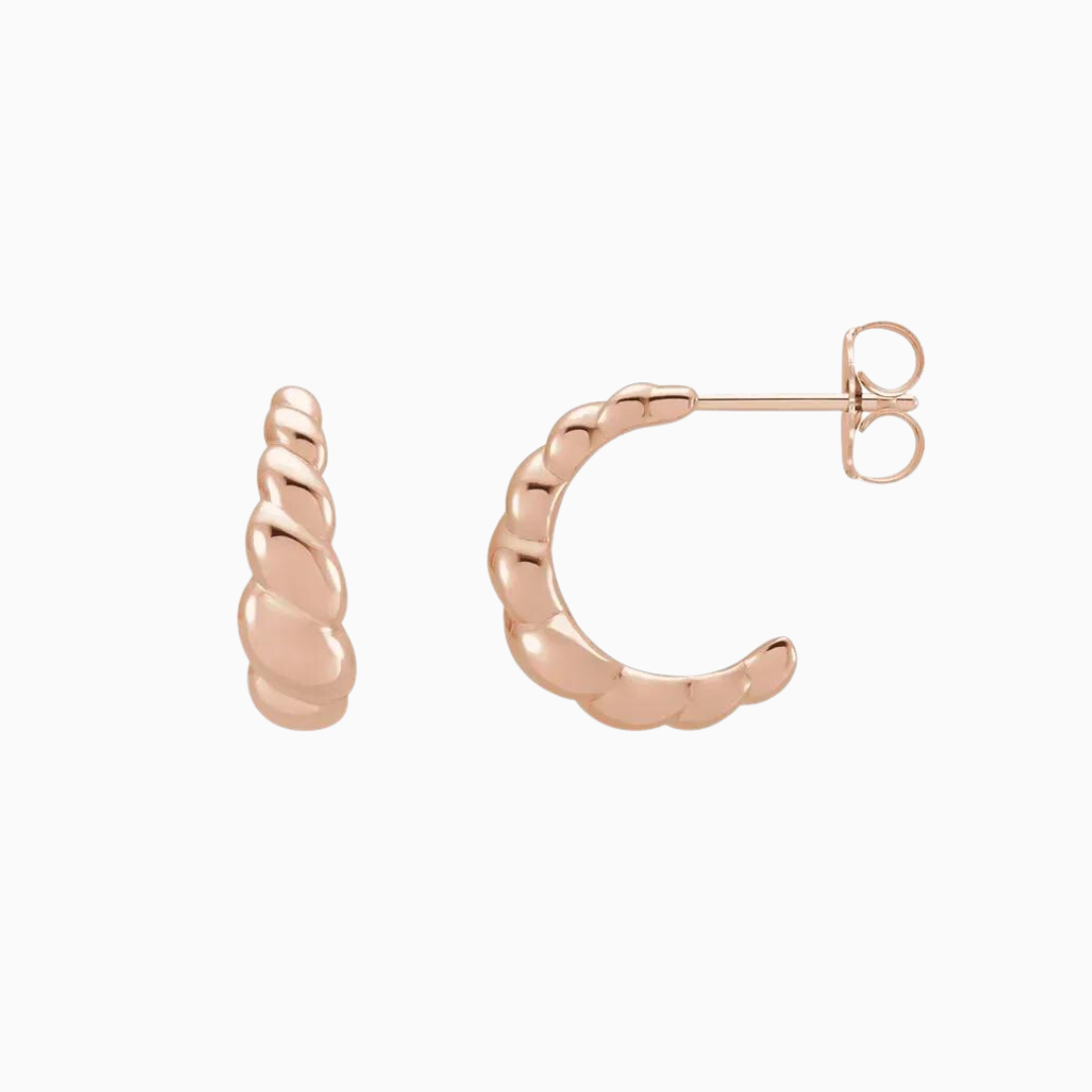 Crafted from 14K gold, these pair of earrings feature a croissant-shaped design.