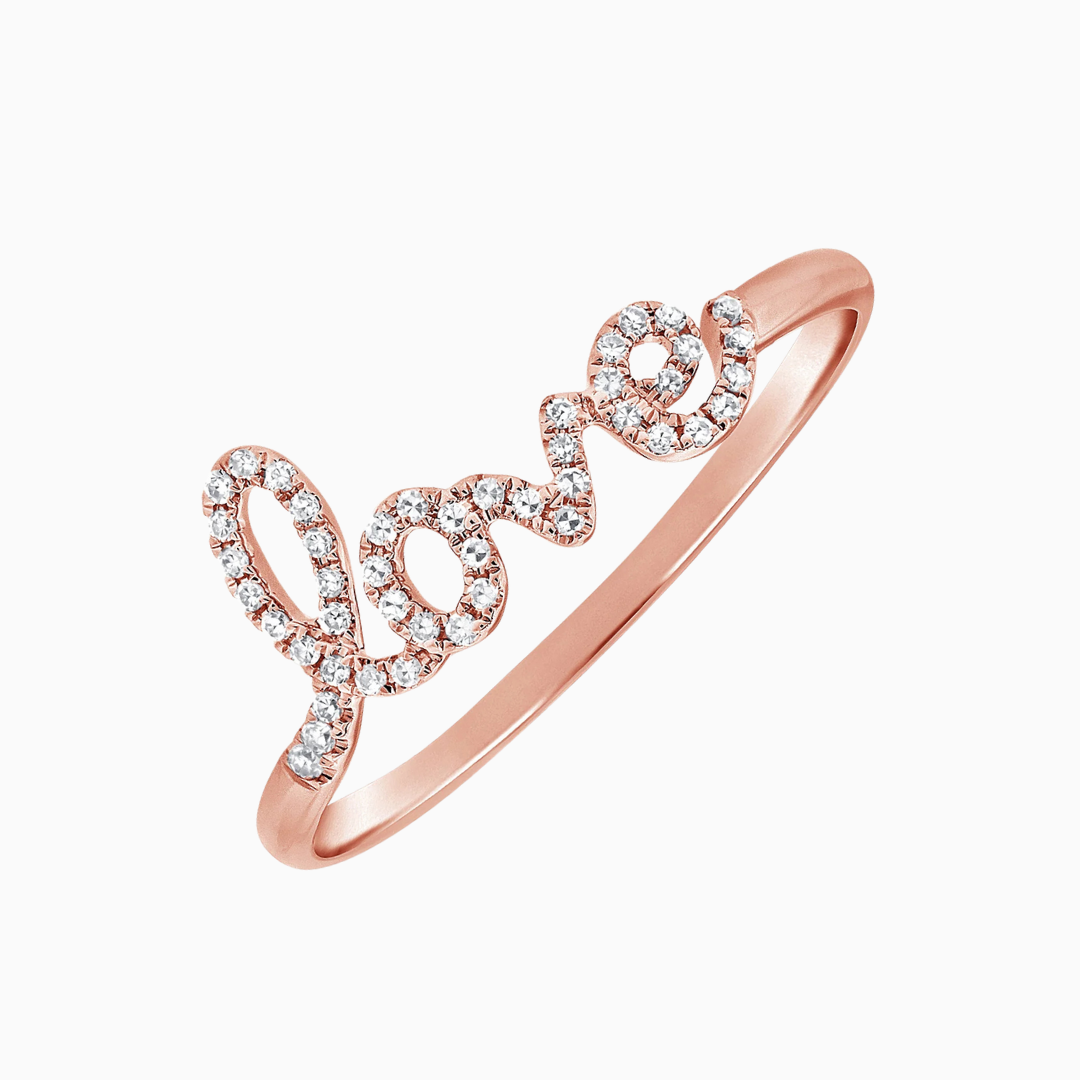 This enchanting Diamond Script Love Ring is crafted in 14k rose gold and features 46 dazzling diamonds totaling 0.10 carats. The delicate script design spells out "Love," adding a personal and romantic touch.&nbsp;