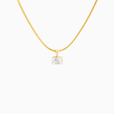 Gold necklace with a pendant on a white background