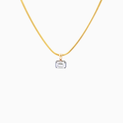 Gold necklace with a rectangular pendant on a white background