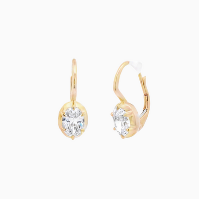 Gold earrings with diamonds on a white background