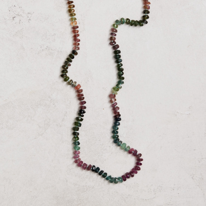 18.5" natural 4mm tourmaline hand knotted on silk and finished with a gold-filled toggle clasp. Handmade by Nicole Gerulat.