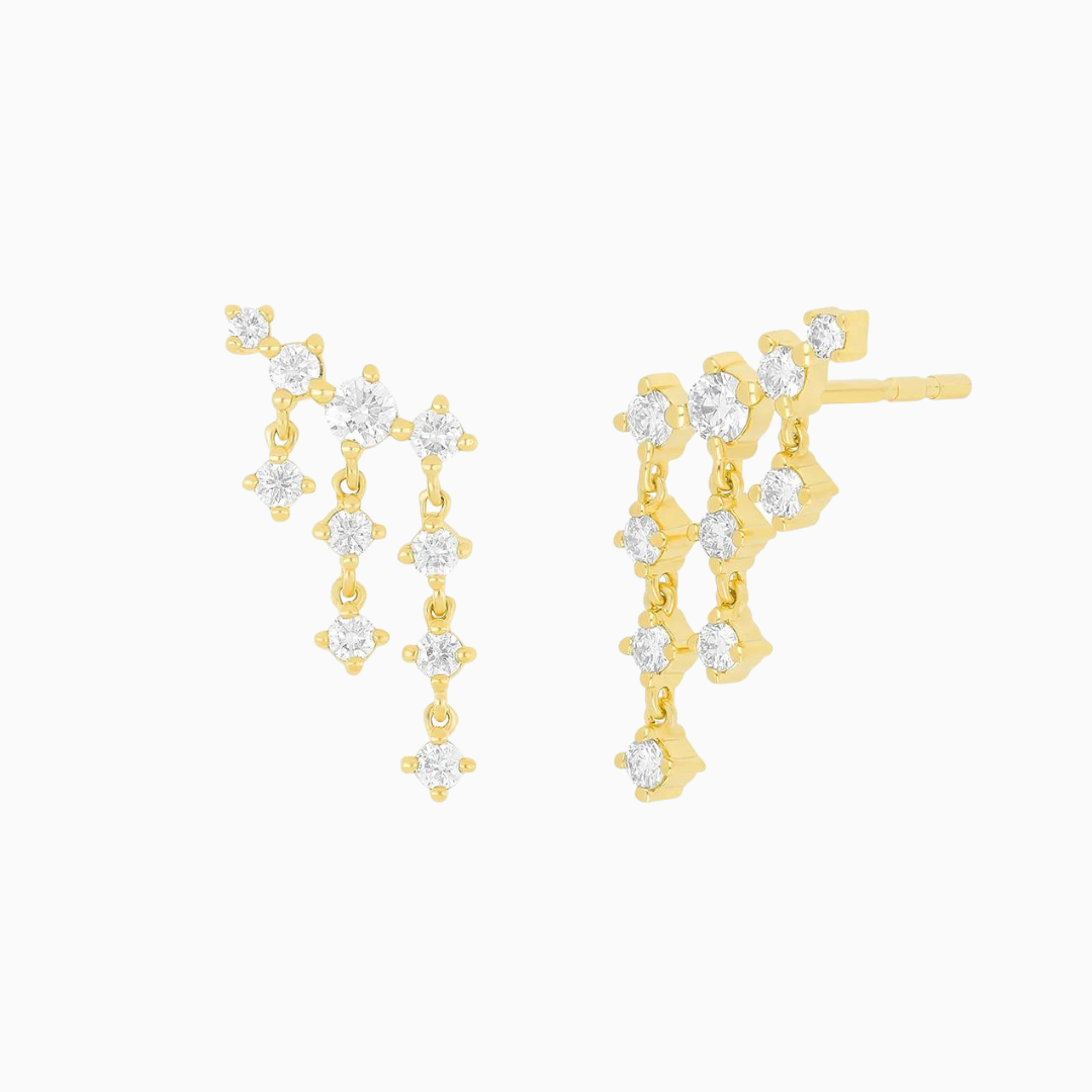 The Diamond Drip Stud Earring dazzles with .4 carats of diamond. Featuring a structured slanting bar of four prong-set diamonds graduating in size with six total diamonds dangling down, this style will drench your ears in sparkle.