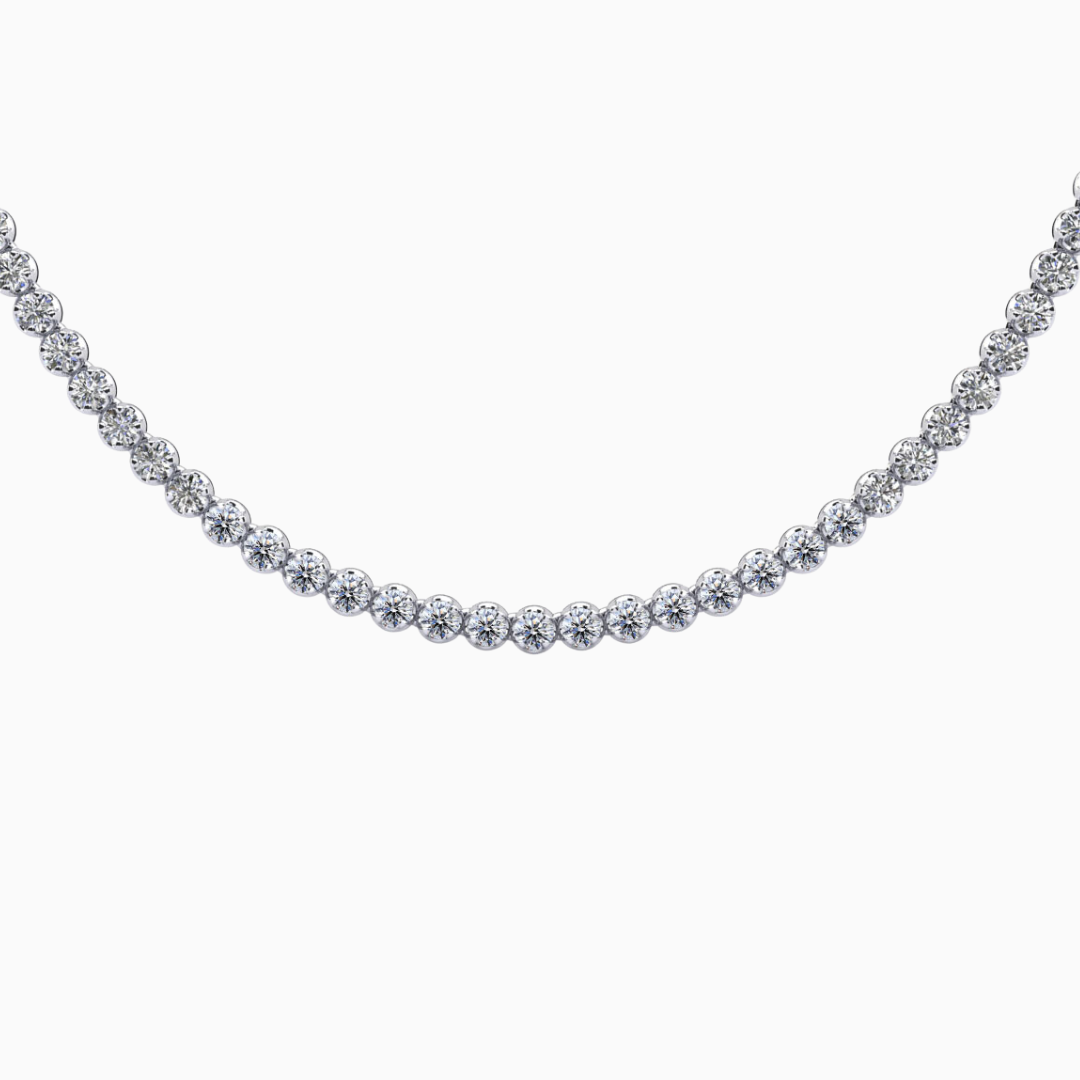 Riviera Diamond Tennis Necklace This beautiful Riviera tennis necklace features brilliant round diamonds of the same size all the way around. It is available in various total carat weights to choose from to match your style and budget. Customize your own today by selecting the metal type and diamond quality. (Contact us for different diamond carat weight or length.)