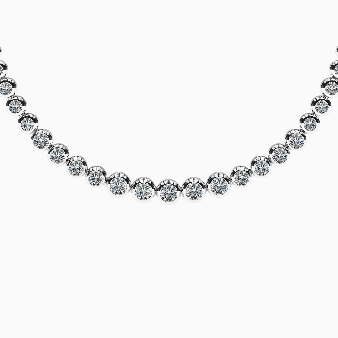 Graduated Diamond Bezel Tennis Necklace Sparks will fly when you wear this brilliant fire graduated diamond necklace. Dazzling round diamonds lend to the beauty of this classic style. With the choice of total carat weights, metal type and diamond quality, you will be sure to shine whenever this piece is worn. (Contact us for different diamond carat weight or length.)