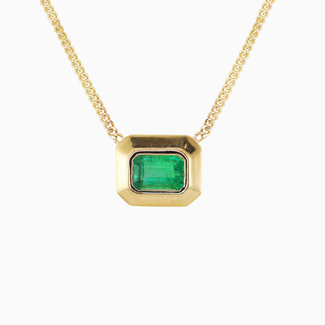 14k Gold Thick Emerald Bezel Necklace on a Flat Link Chain.  0.65 CT natural emerald -each piece will vary slightly in color and shade 16" flat link chain