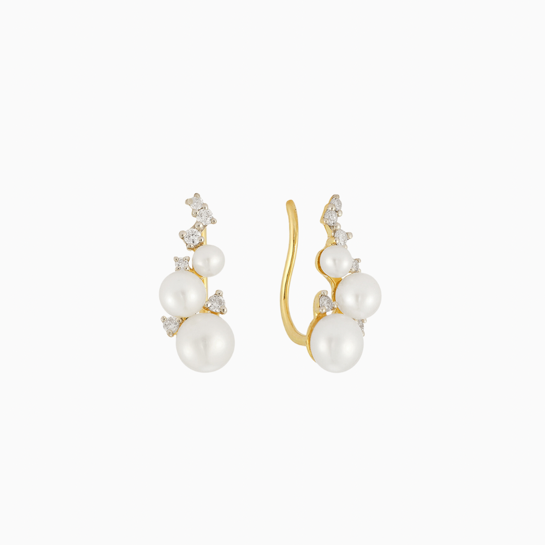 The Diamond & Pearl Ear Climber shines with three freshwater pearls, which gradually variate in size, plus six decoratively-placed diamonds. Designed to climb up the lobe, or embellish the cartilage, this earring expertly combines classic with modern. Like your grandmother's pearls—but better.