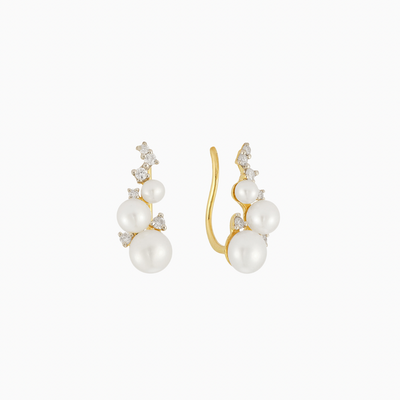 The Diamond & Pearl Ear Climber shines with three freshwater pearls, which gradually variate in size, plus six decoratively-placed diamonds. Designed to climb up the lobe, or embellish the cartilage, this earring expertly combines classic with modern. Like your grandmother's pearls—but better.