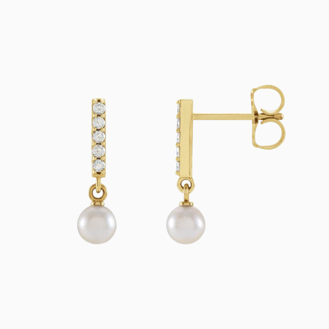 Constructed from 14k gold, these diamond bar earrings boast a cultured akoya pearl drop and .03 CTW of natural diamonds. Choose from yellow, white, and rose gold.