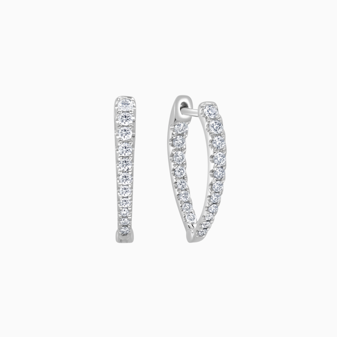 Crafted from 14k gold, these pointed oval hoops feature a dazzling diamond inside-out design.  earring length: 3/4 inches 0.46 ctw natural diamonds diamond count: 38