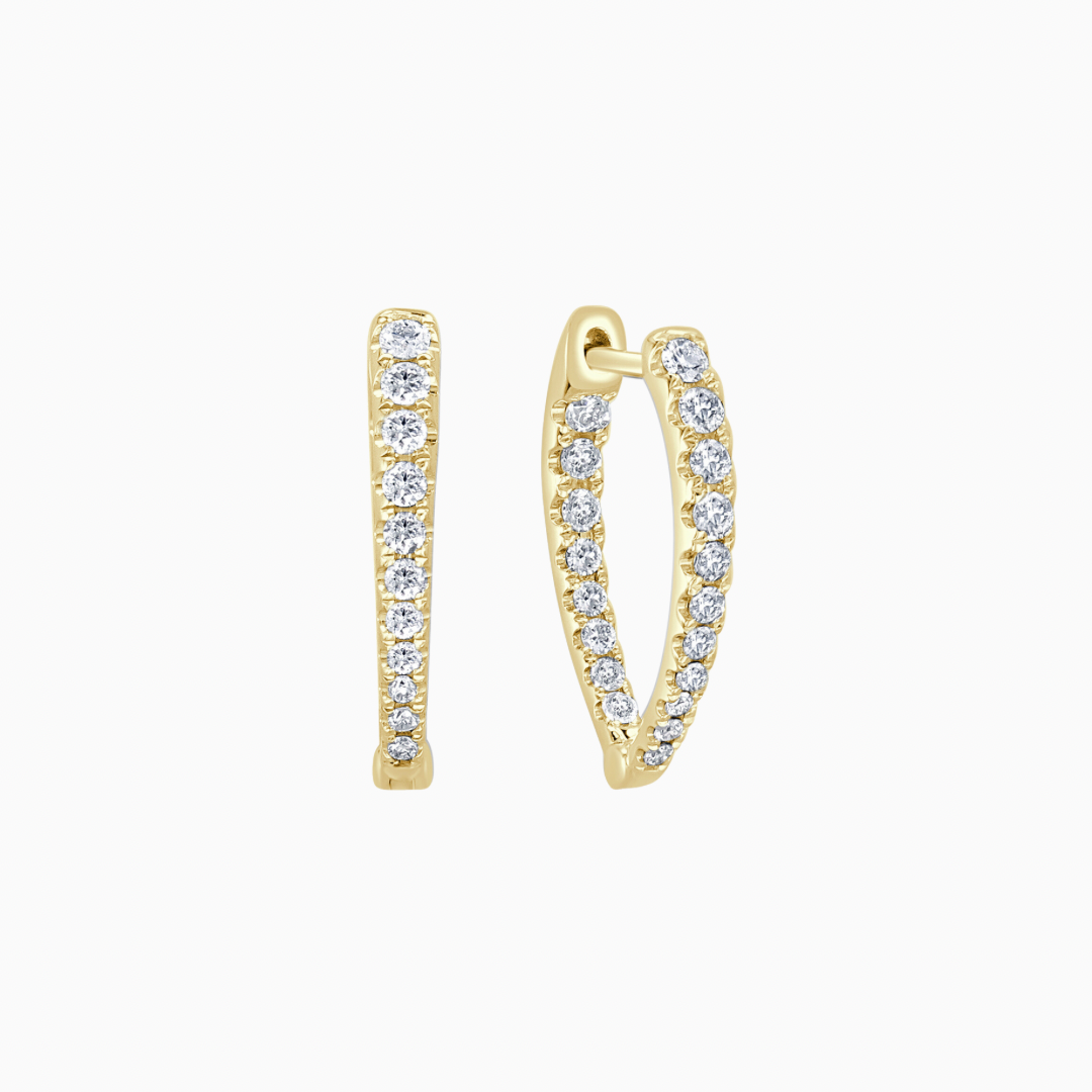 Crafted from 14k gold, these pointed oval hoops feature a dazzling diamond inside-out design.  earring length: 3/4 inches 0.46 ctw natural diamonds diamond count: 38