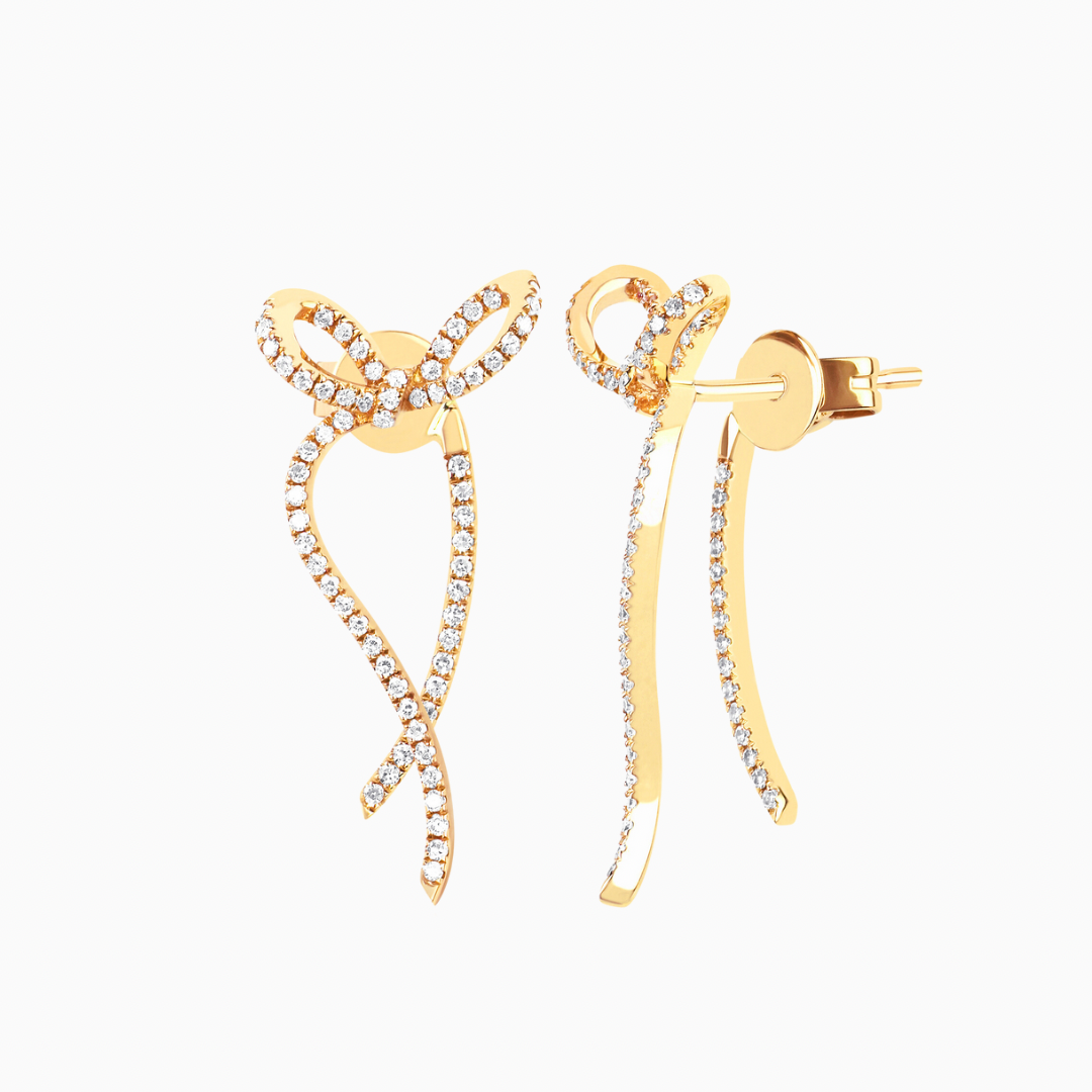 These diamond bow earrings from EF Collection features 0.34 carats of diamond set in 14k gold.