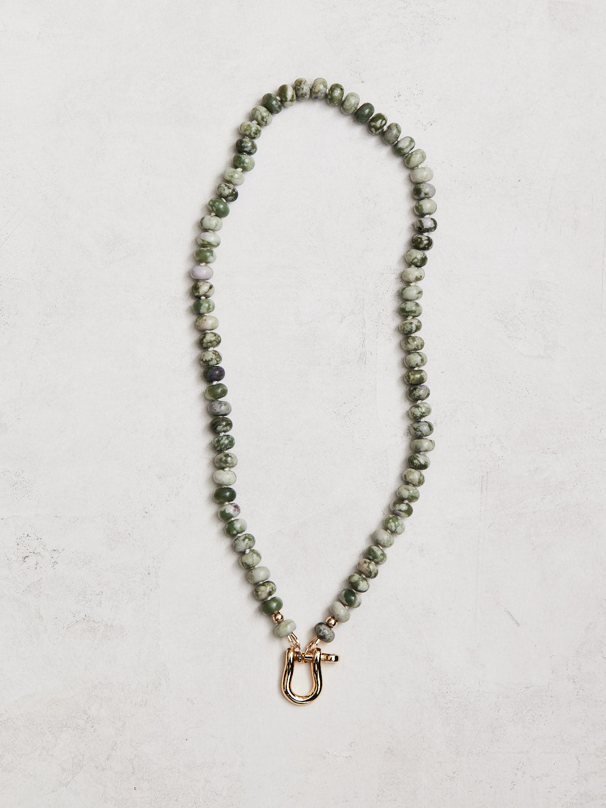 18" 8mm natural lavender jade, hand-knotted on silk with gold-filled beads and horseshoe connector. (you may switch out the connector!) Handmade by Nicole Gerulat.