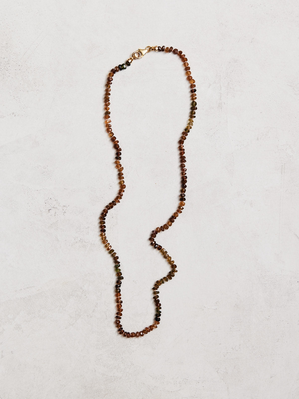 19" natural green & copper tourmaline hand-knotted on silk with gold-filled findings & lobster clasp.