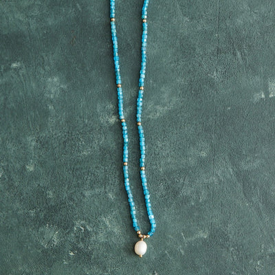 15" neon apatite cubed with gold-filled beads and a freshwater pearl pendant with a gold-filled magnetic clasp.  Handmade by Nicole Gerulat.