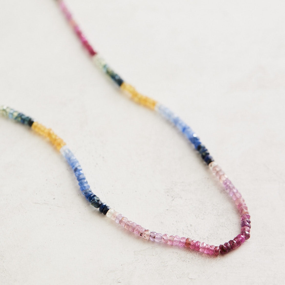 16.5" natural sapphires finished in 14k gold findings & clasp.  Handmade by Nicole Gerulat.