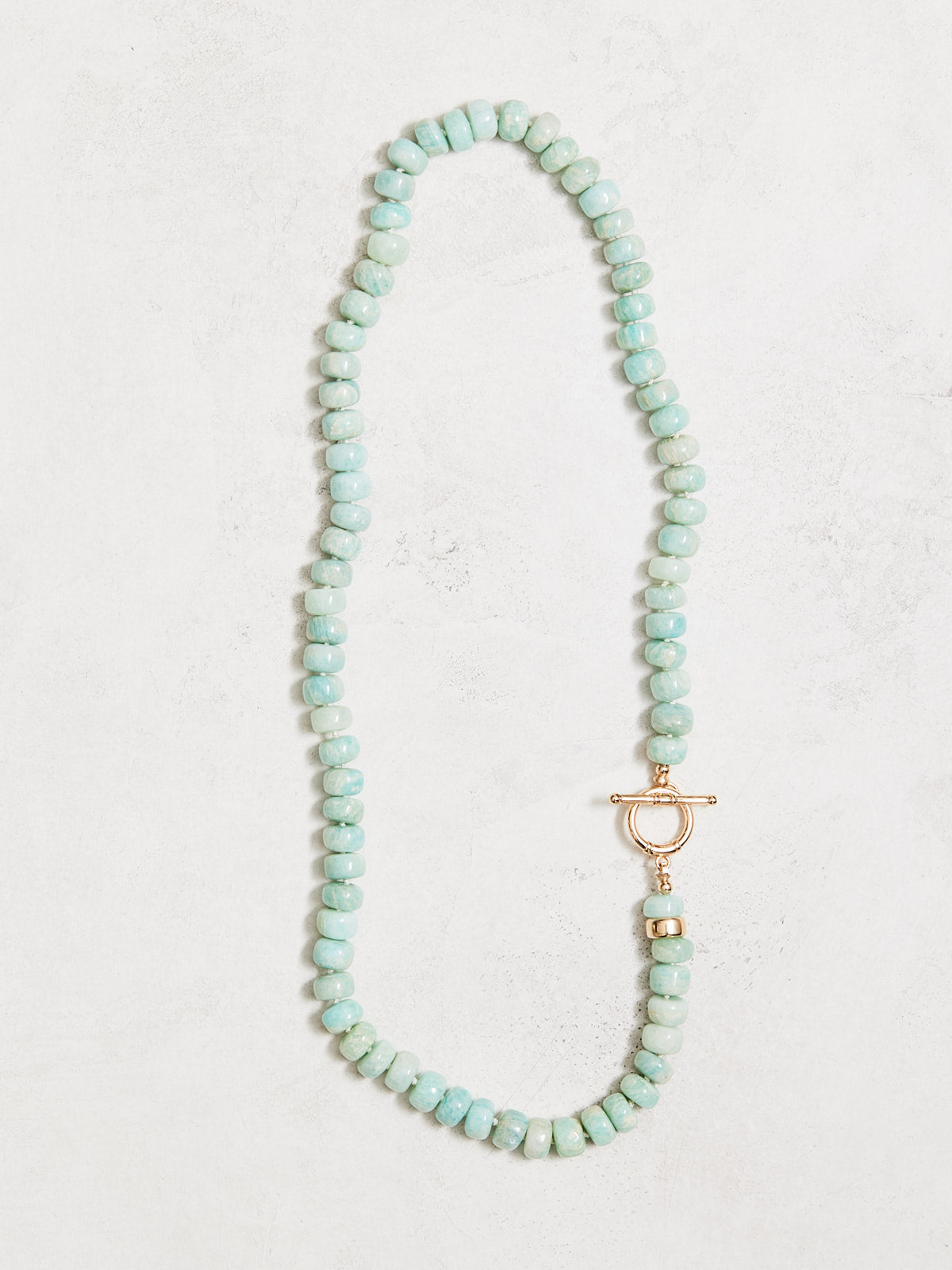 18" natural greenish blue aquamarine necklace, hand-knotted on hand-dyed silk, with gold-filled findings and elongated clasp. Handmade by Nicole Gerulat.