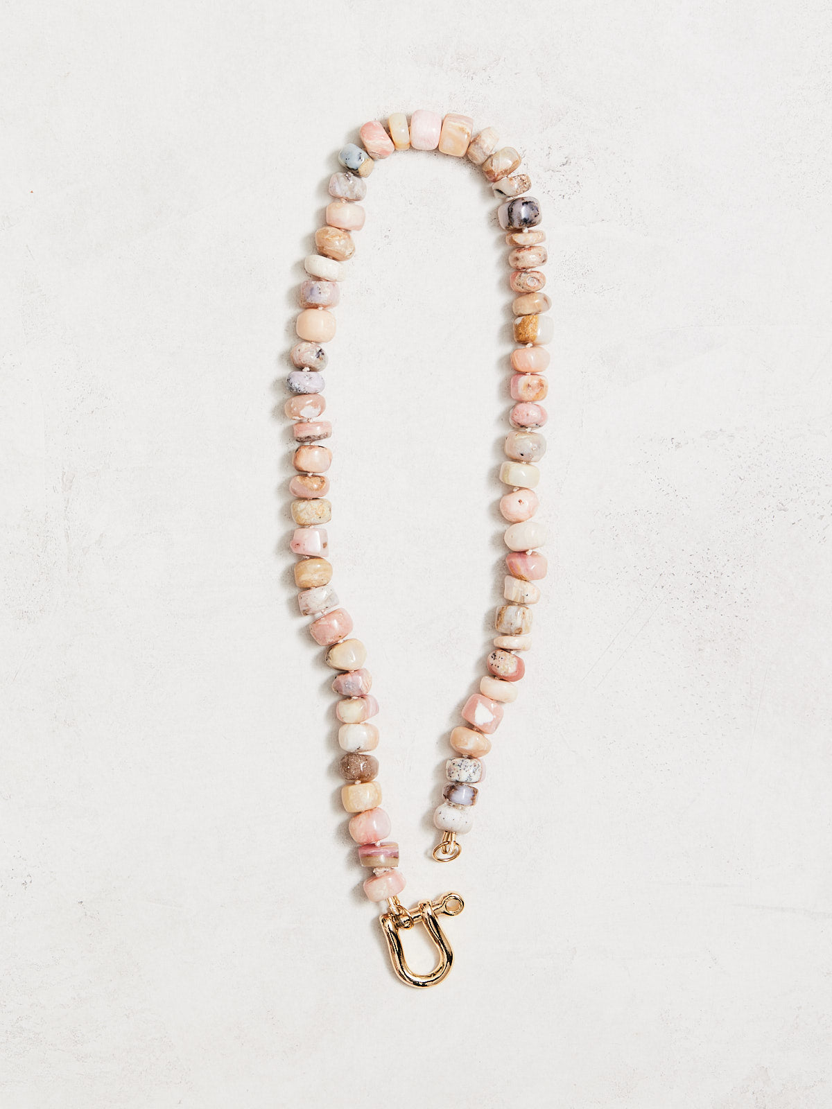 16" medium australian opals hand-knotted on ivory silk with gold-filled findings & a horseshoe clasp. Handmade by Nicole Gerulat