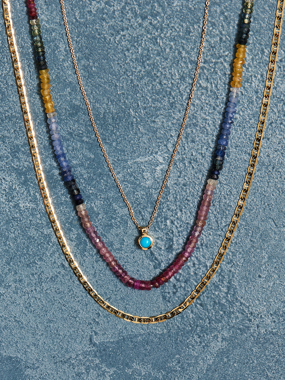 16.5" natural sapphires finished in 14k gold findings & clasp.  Handmade by Nicole Gerulat.