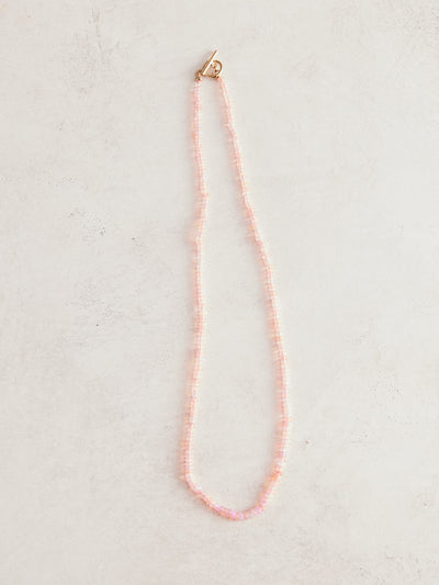 16.5" natural pink Ethiopian necklace strung on hand-dyed neon pink silk with gold-filled findings and toggle clasp. Handmade by Nicole Gerulat.