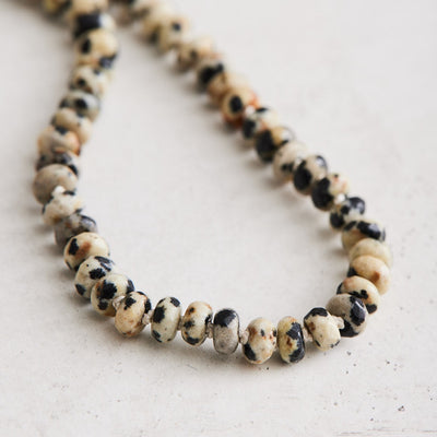 This 18.5" necklace is crafted with natural dalmation jasper and hand-knotted on silk with gold-filled findings plus a lobster clasp. Handmade with care by Nicole Gerulat.