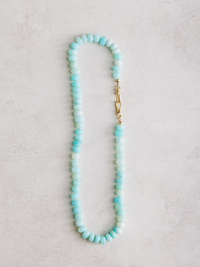  This necklace features almost 18" of hand-knotted blue opals on a hand-dyed blue silk cord, fastened by gold-filled findings and swivel lobster clasps. All pieces carefully crafted by Nicole Gerulat.