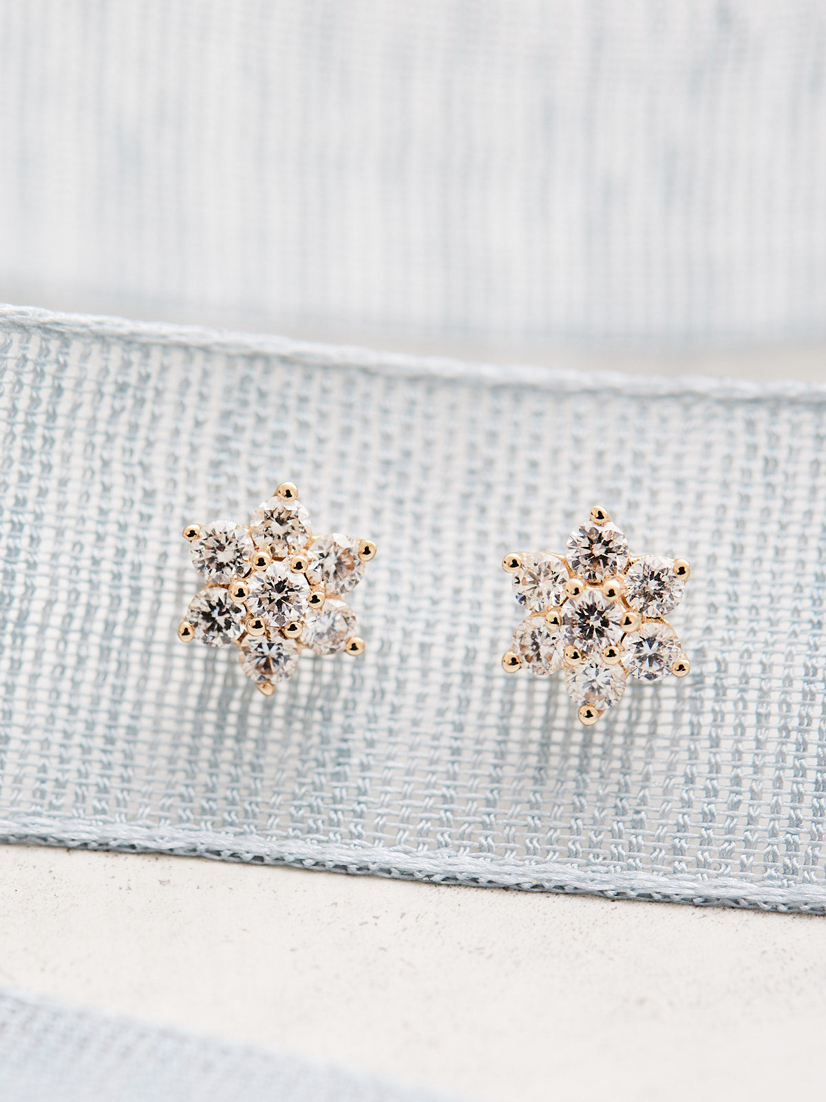 Crafted with 14k gold and natural diamonds, these flower-shaped studs offer 3/8 CTW of sparkling diamonds to enjoy. Sold as a pair.