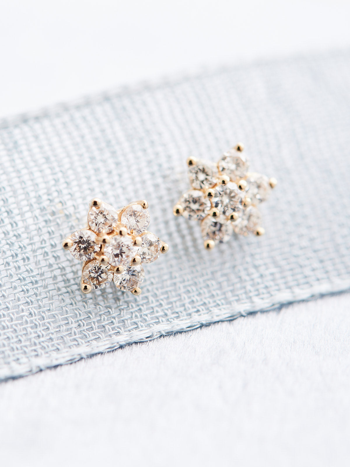 Crafted with 14k gold and natural diamonds, these flower-shaped studs offer 3/8 CTW of sparkling diamonds to enjoy. Sold as a pair.