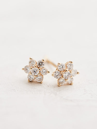 Crafted with 14k gold and natural diamonds, these flower-shaped studs offer 3/8 CTW of sparkling diamonds to enjoy. Sold as a pair.