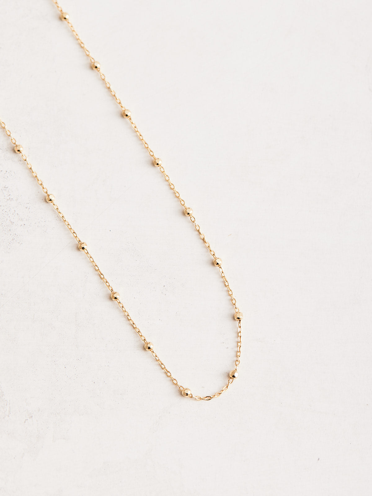 1.7mm 14k Gold Faceted Beads Chain Necklace, available in different materials and lengths.