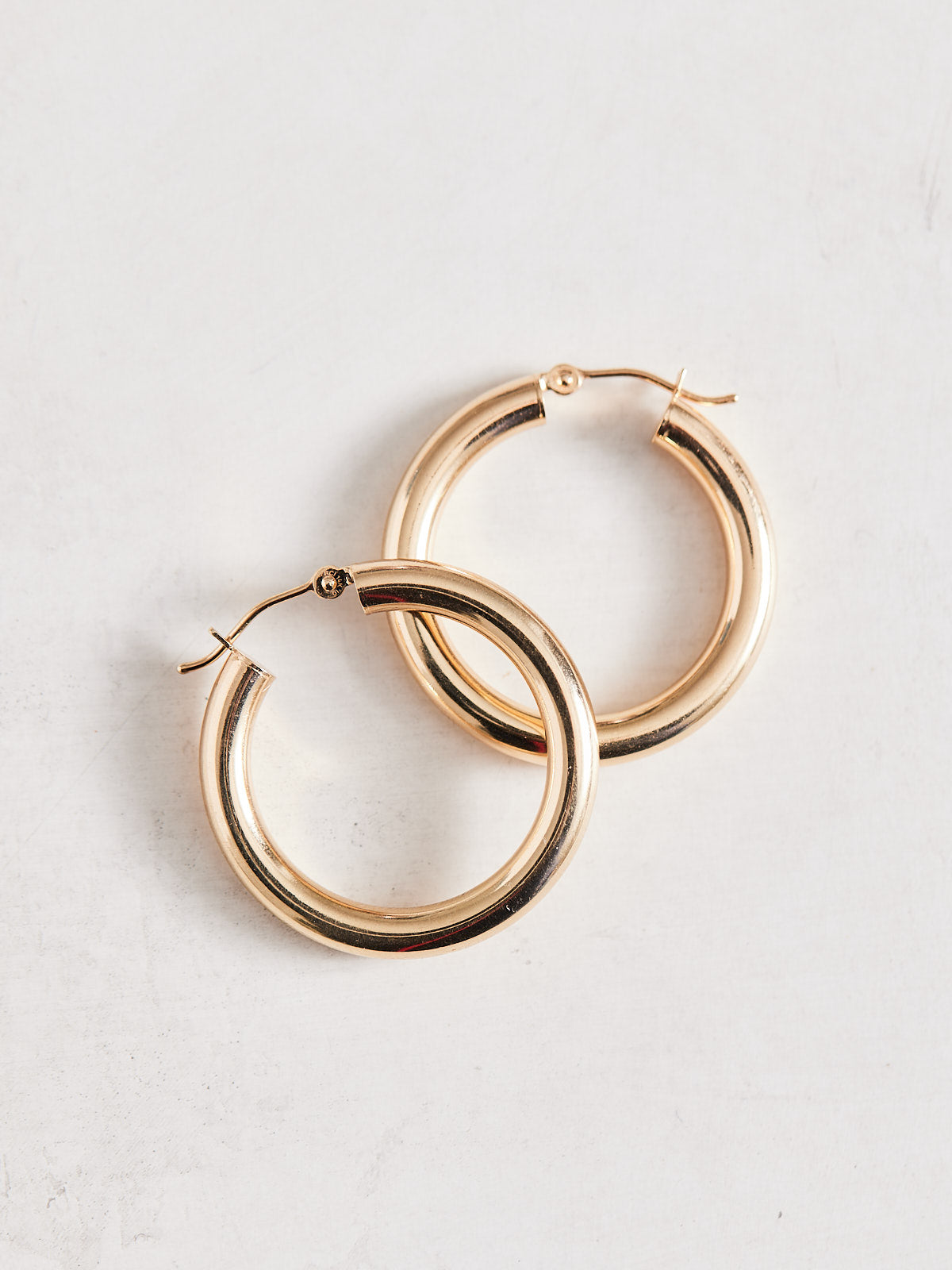 Big Hoop Energy Tube Earrings. Super lightweight and 14k gold, sold in 3 sizes.