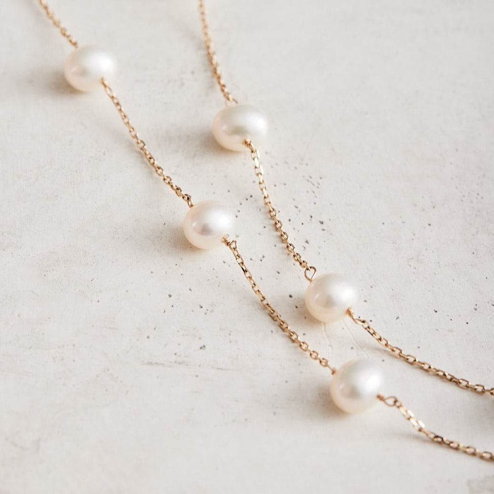 18" 14k gold & pearl 14-station necklace, available in yellow and white gold.