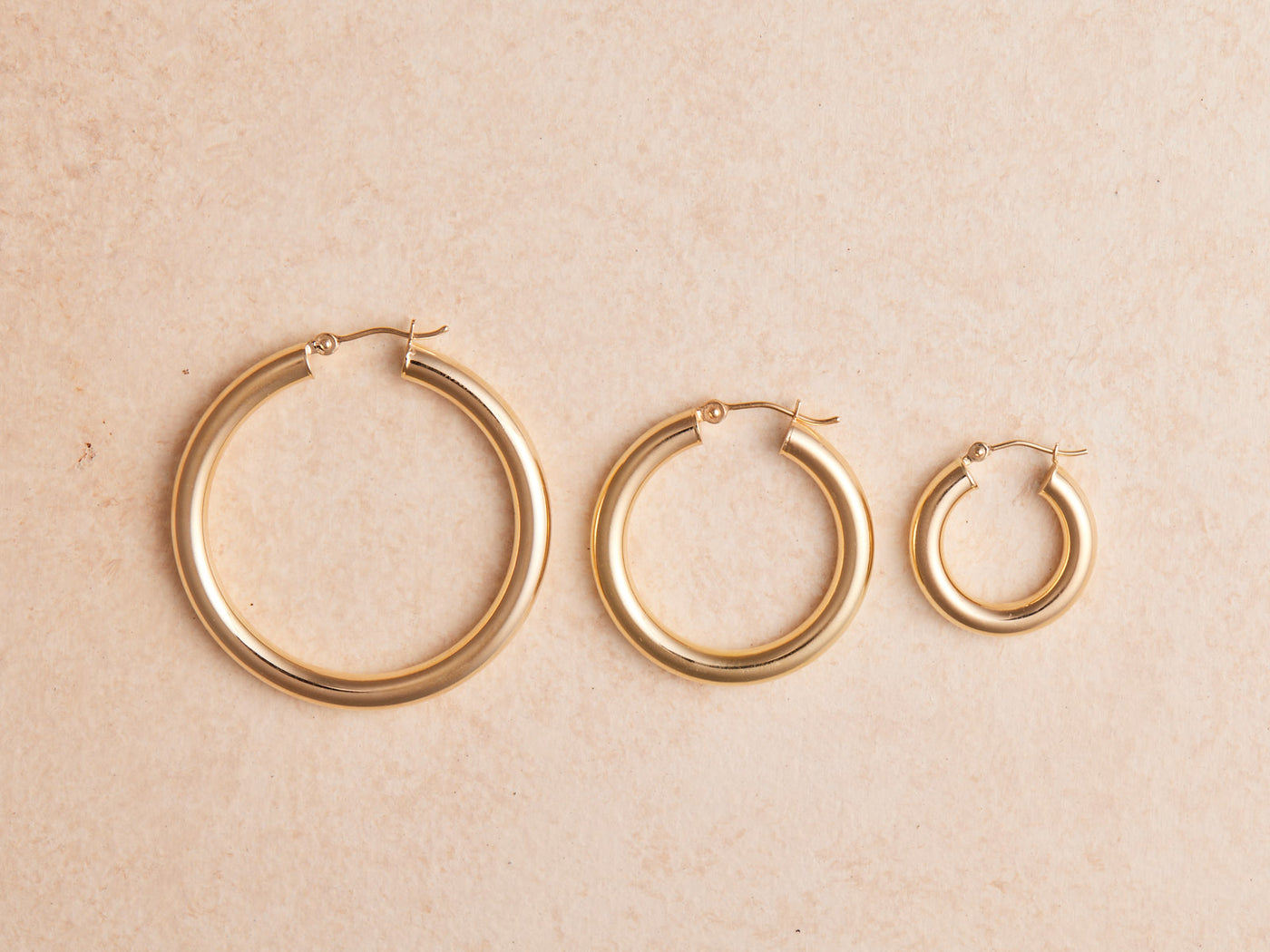 Big Hoop Energy Tube Earrings. Super lightweight and 14k gold, sold in 3 sizes.