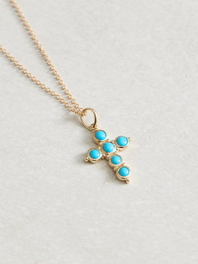 14k Gold & Natural Turquoise Cross, 25.95mm x 14.31 mm.  All proceeds for this necklace are donated to Latter-Day Saint Charities -a charity that provides aid to people around the world without regard to cultural or religious affiliation. Key projects include: emergency response, vision care, maternal & newborn care, wheelchairs, clean water, immunization & food initiatives. Read more about LDS Charities here.