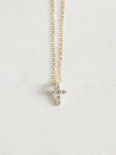 This adjustable 16-18" 14k Gold & Natural Diamonds Cross Necklace features 1/6 ct of Natural Diamonds in an 8.7 x 6.3mm size. It is available in yellow, white, and rose gold.