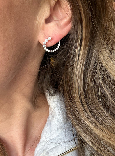 These front-back diamond earrings have 7/8 ctw natural diamonds set in 14k gold. The graduated end tucks behind the lobe for a beautiful illusion of a completed circle that stays facing front. 15mm. Available in white, yellow and rose gold.